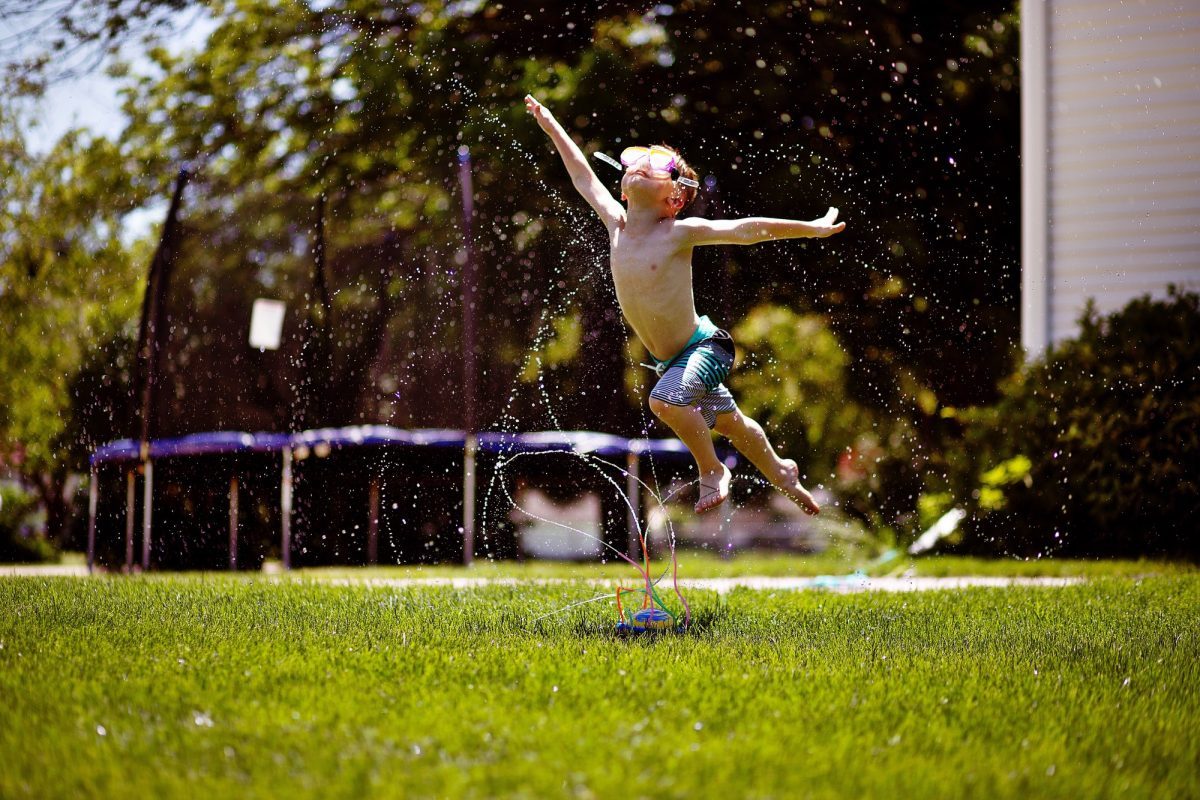 Playing in the sprinklers, flying in the sky